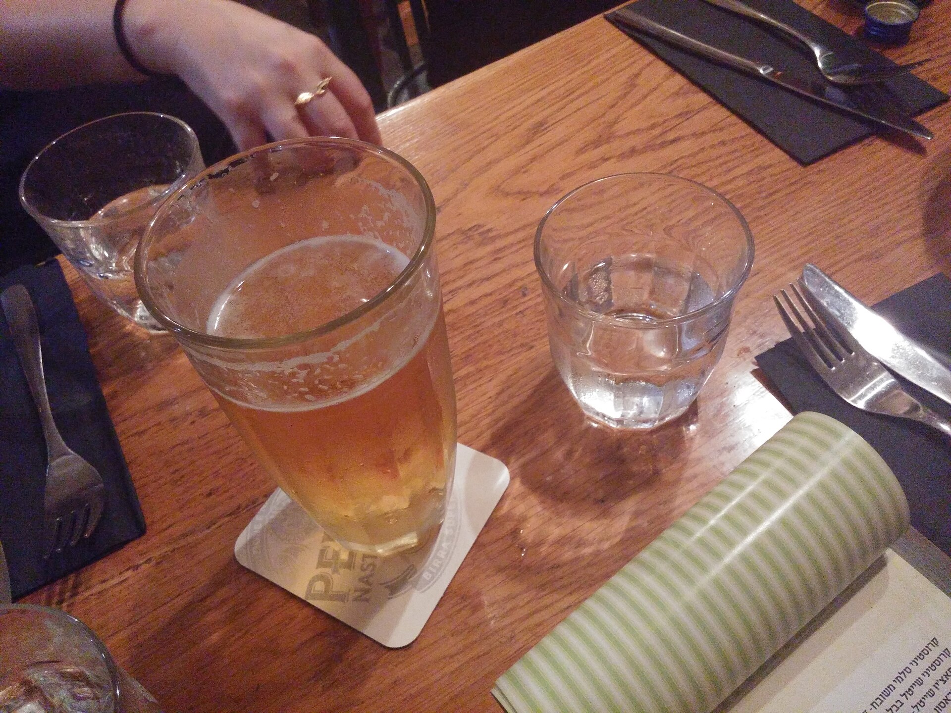 Glass of local craft beer on a wooden table