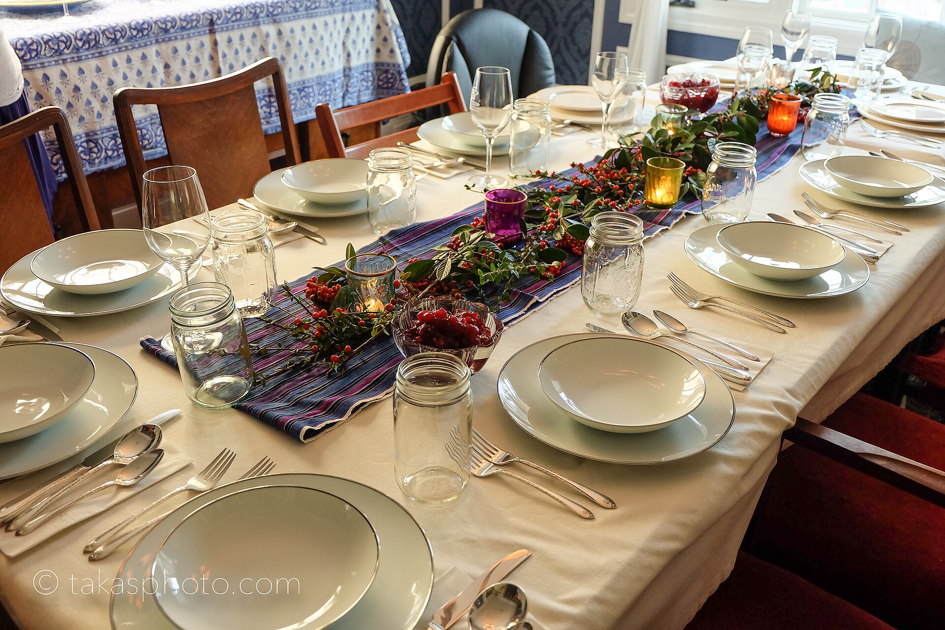 Long dinner table set for a big group celebration